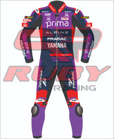 Front view of Miguel Oliveiraās 2025 Yamaha Prima MotoGP leather race suit in dark navy, red, and purple tones, showing detailed logos of Pramac, Yamaha, Alpine, and Ruby.